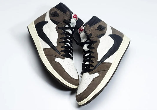 Travis Scott x Air Jordan 1 with reverse swoosh and brown suede detailing – available at Raf Sneakers Trieste